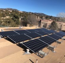 15-panel system on a flat roof in the foothills of Santa Fe.